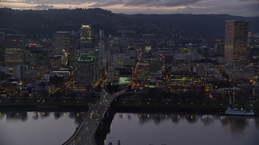 Skyline of an urban city with illuminated buildings during dusk