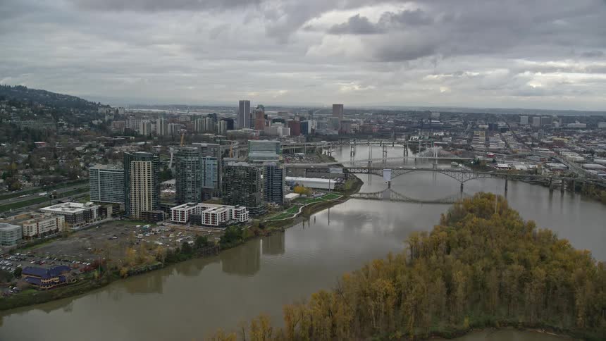 Aerial view of a city and a lake with several bridges