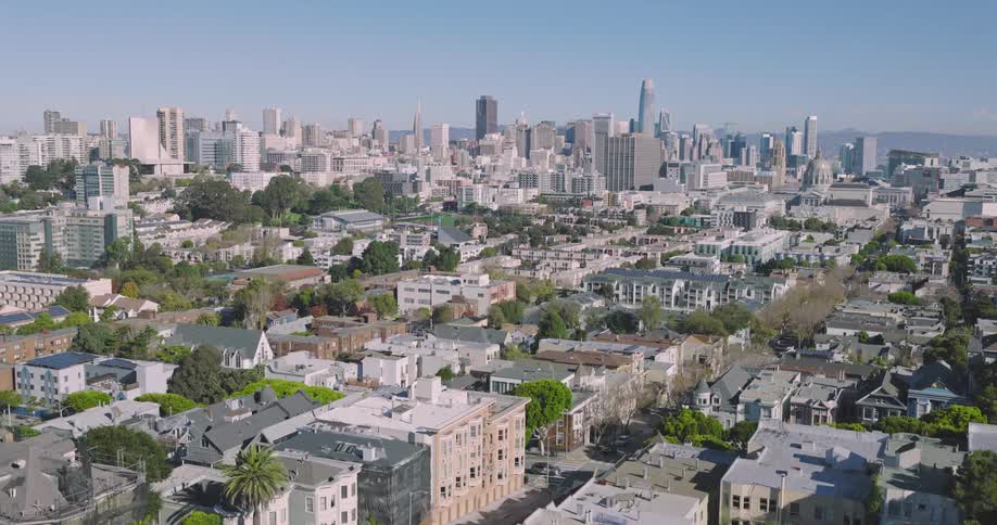 Aerial view of distant high buildings and houses in the neighborhood in the big city