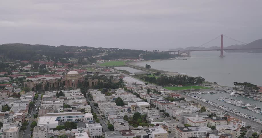 Aerial panorama of an urban city by the seaside on a cloudy day