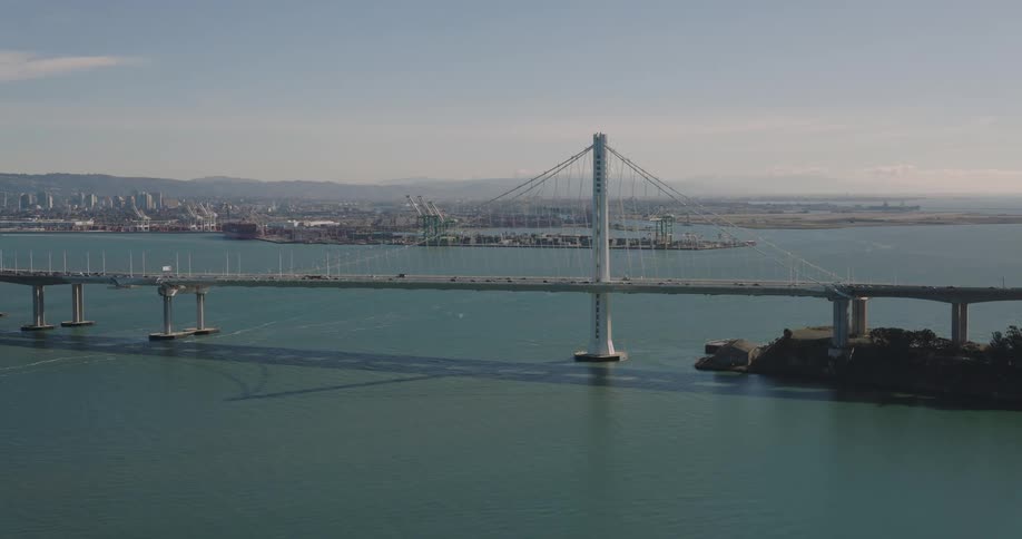 Vehicles travel over the large bridge