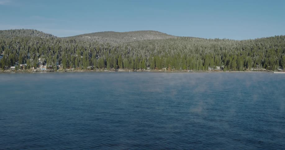 Aerial view of light mist over a lake in the mountains