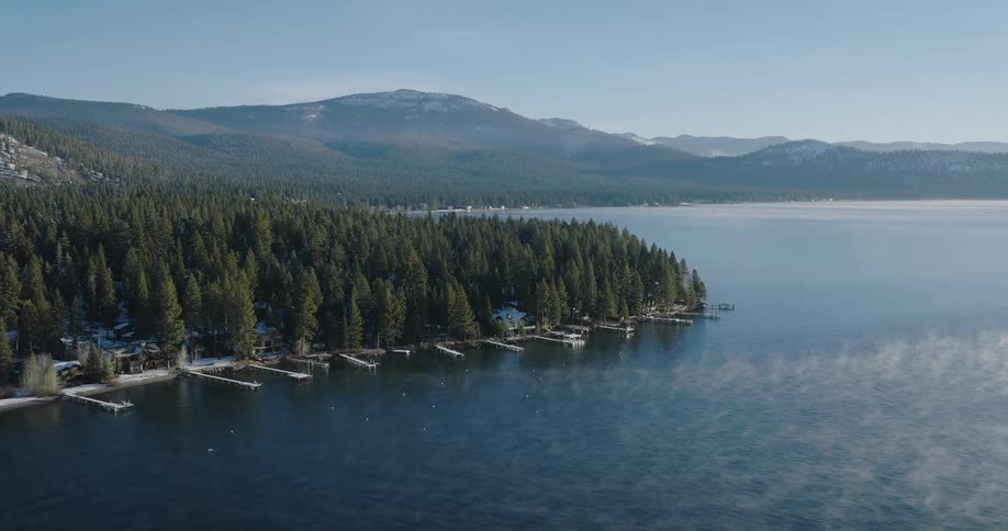 An aerial view of the shore closer to the woods