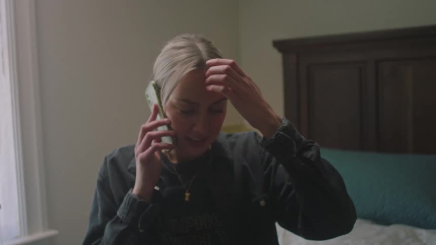 A woman is talking on her cell phone
