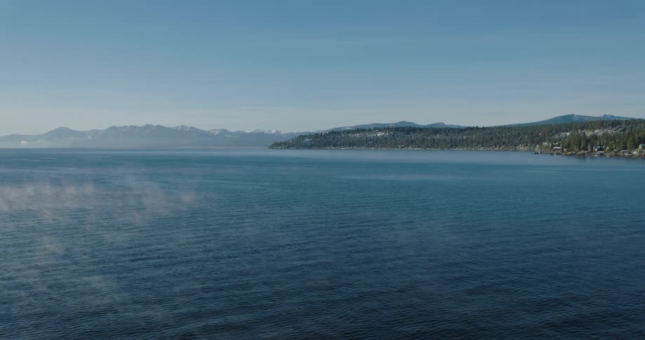 Aerial panorama of the sea with a mountain range on the horizon
