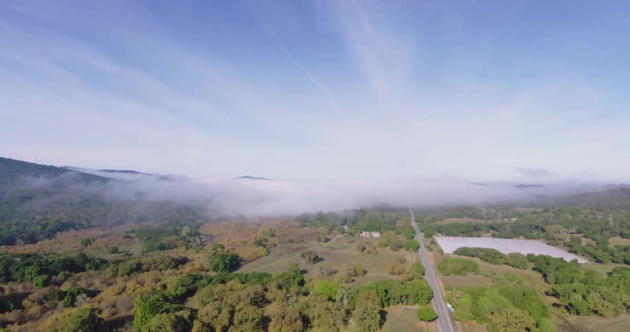 Aerial view of low clouds over the countryside