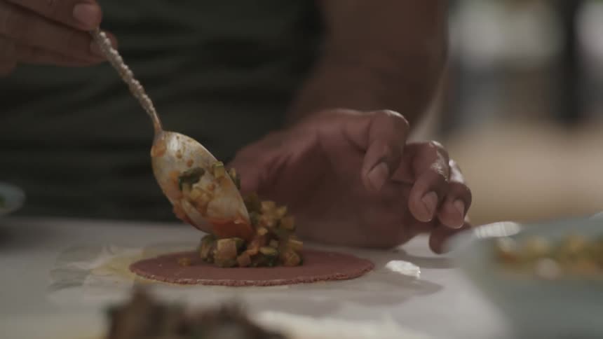 A person is serving some food