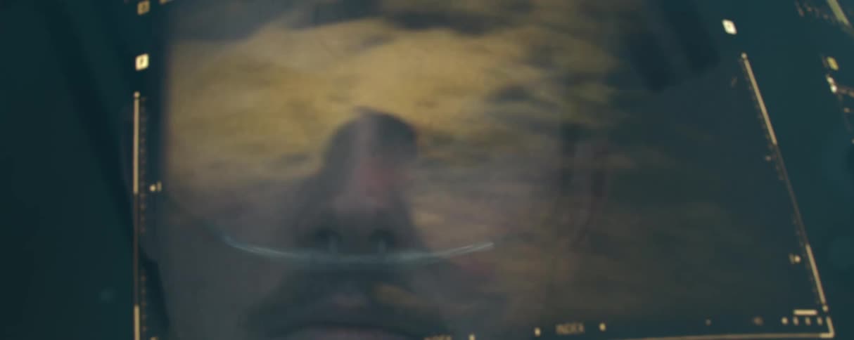 Flashing images on a screen in front of the face of a man