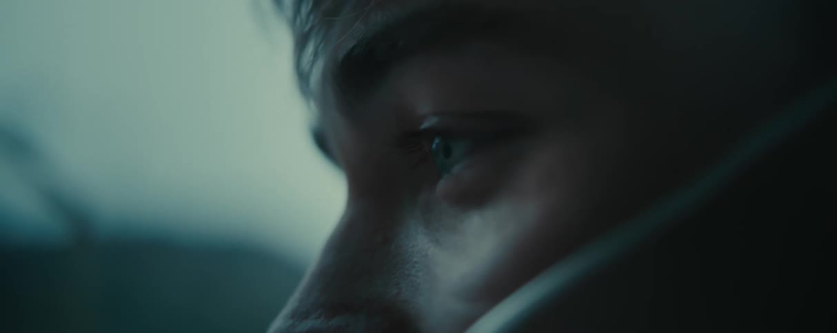 Closeup of the side view of a mans face with a facial expression of despair