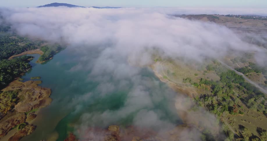Aerial view of white clouds over a river