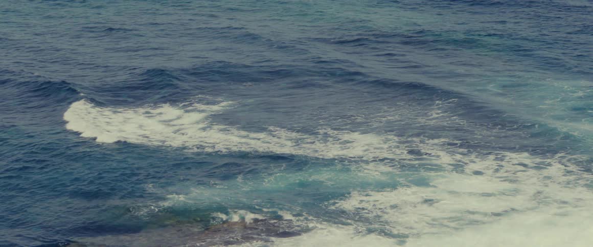 Panorama of a sea view with gentle waves crashing