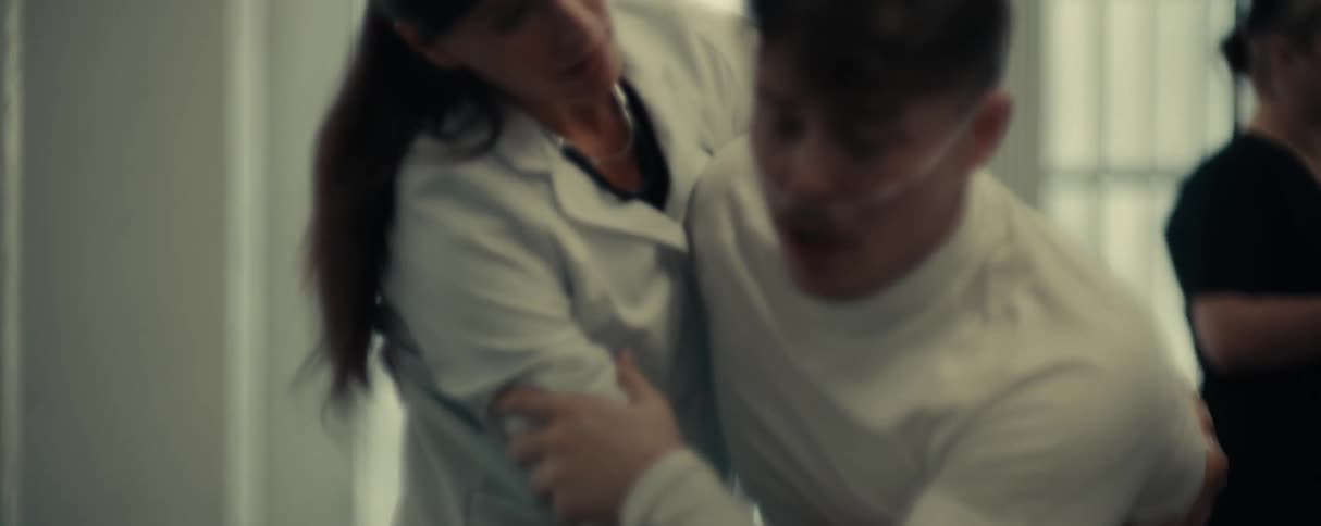 Patient becomes startled and is helped away by a female doctor