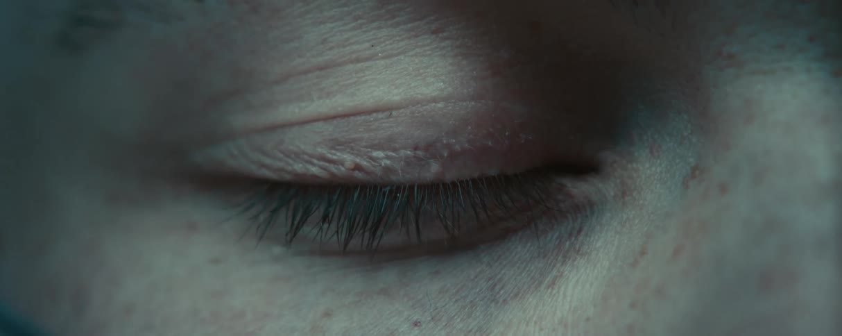 A persons eye was closed and opens