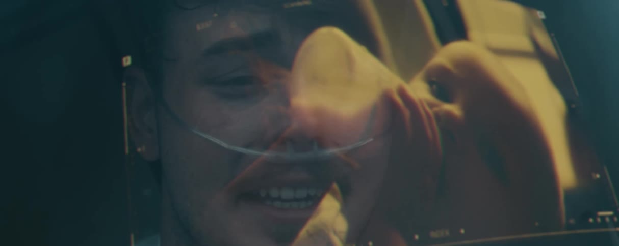 A patient is watching his baby on a display and crying