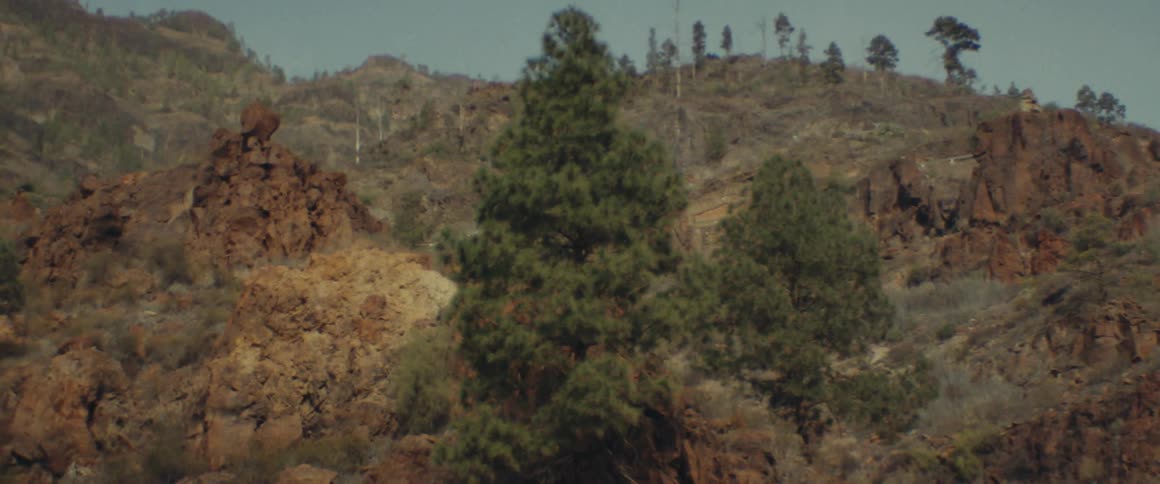 View of a cars solar roof with natural mountains in the daylight