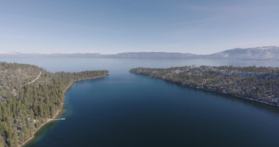 Aerial view of a river leading to a lake in the mountainstion