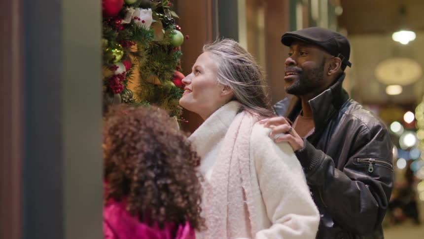 Family out in late shopping at christmas