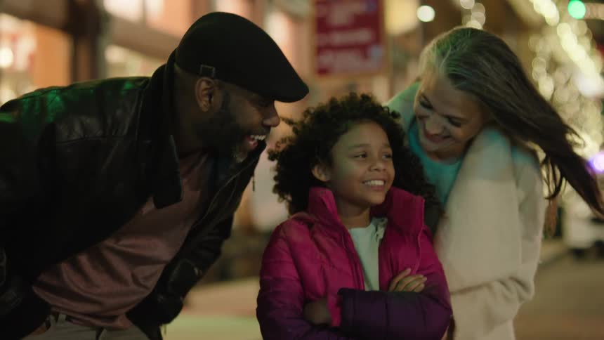 Closeup of a smiling family taking a photo