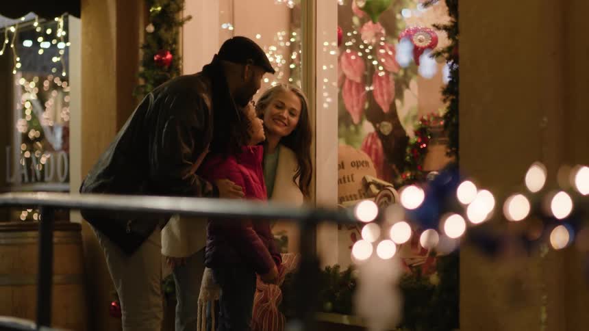 Happy family looking at stores in christmas