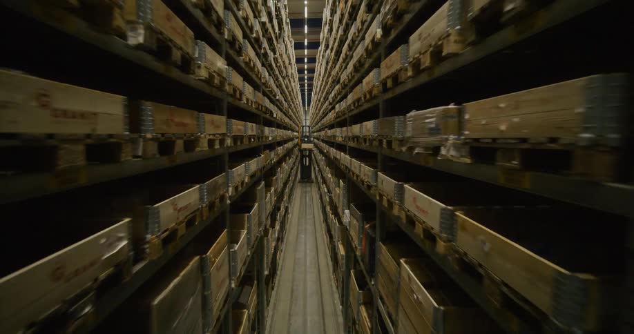 fpv drone flying through the aisles on a warehouse