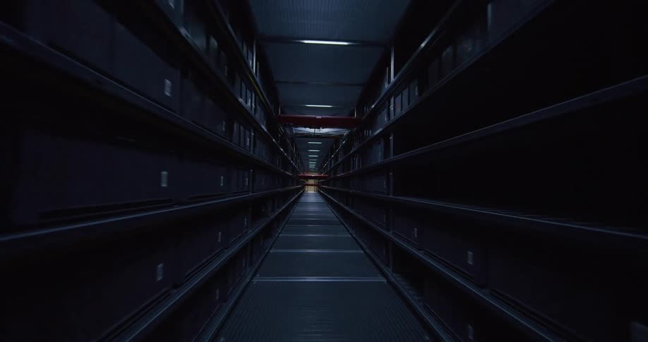 Interior view of a corridor filled with shelves and boxes