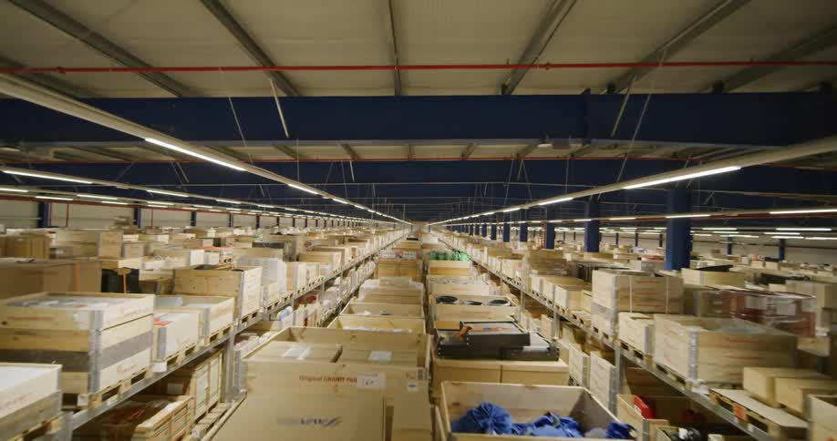 fpv drone flying through the aisles on a warehouse