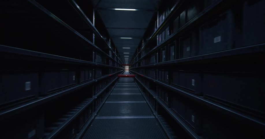 fpv drone flying through the aisles on a warehouse