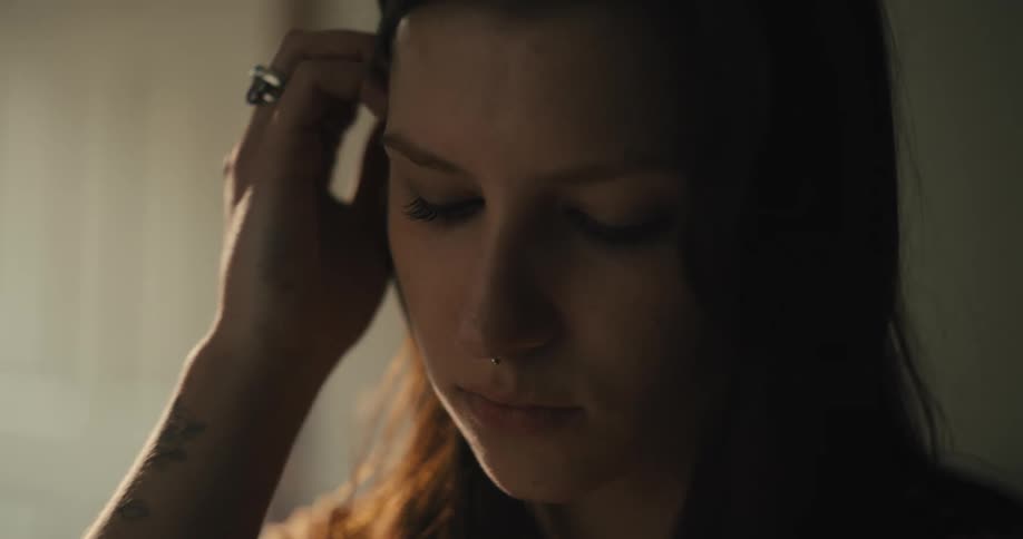 Woman whispers on the ear of a friend