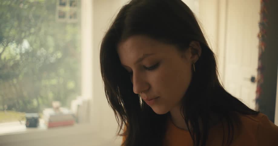 Close up of the face of a woman listening to someone