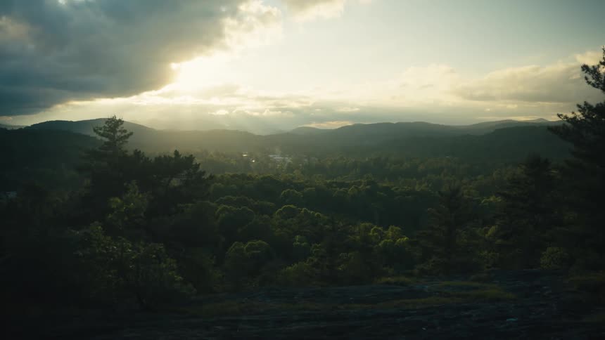 Small village on a forest in the mountains at evening