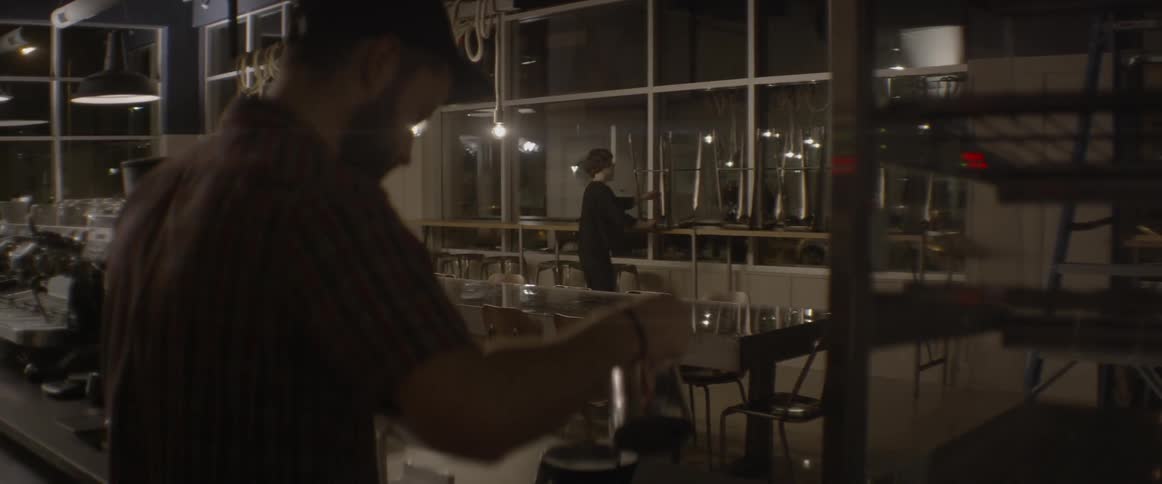 People are working in a restaurant setting up