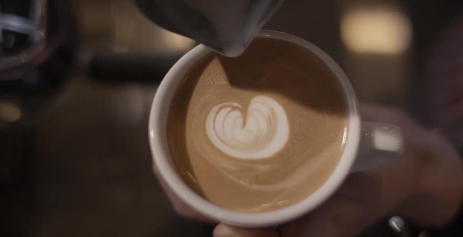 Cream is used to make an image in a cup of espresso