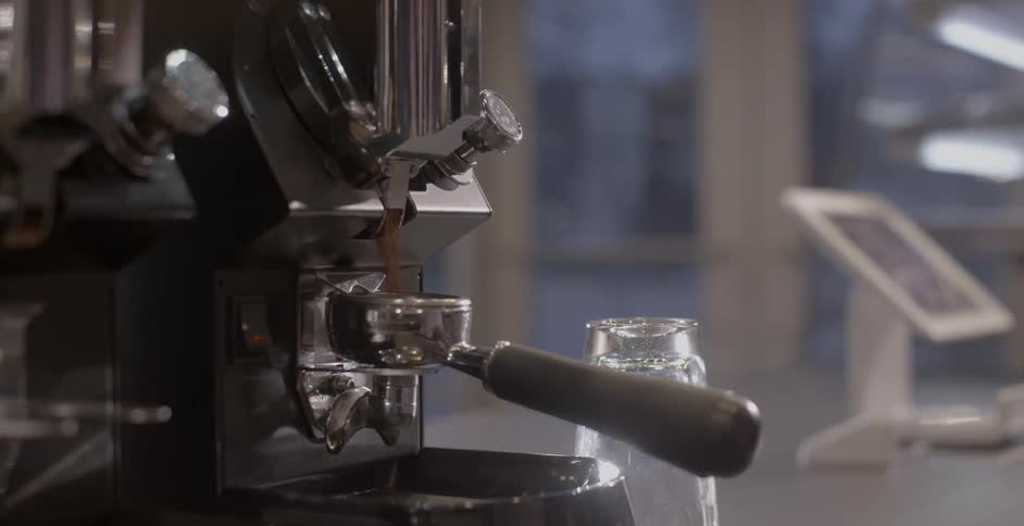 Barista grinds coffee beans