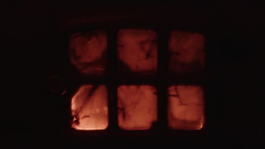 Lights flash behind the door in the dark