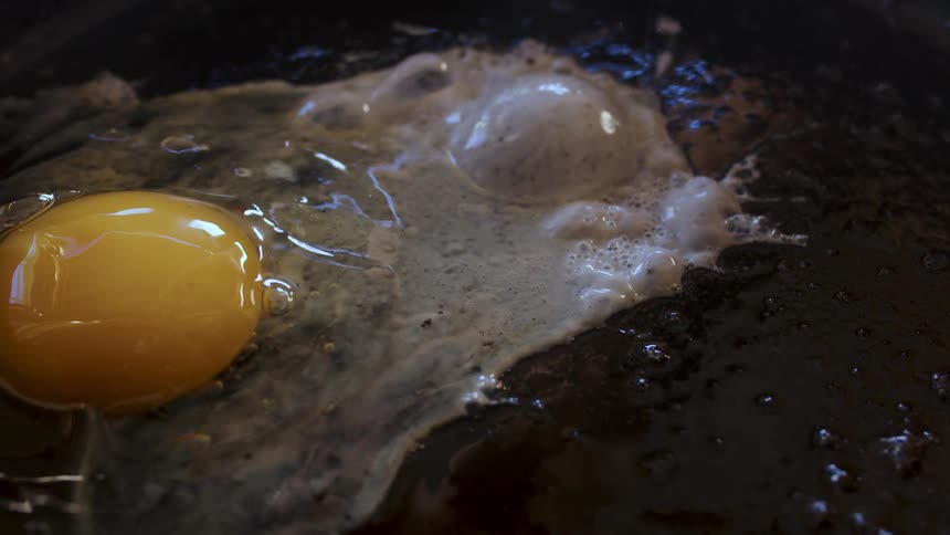 Egg yolk dropped inside a hot oil to fry