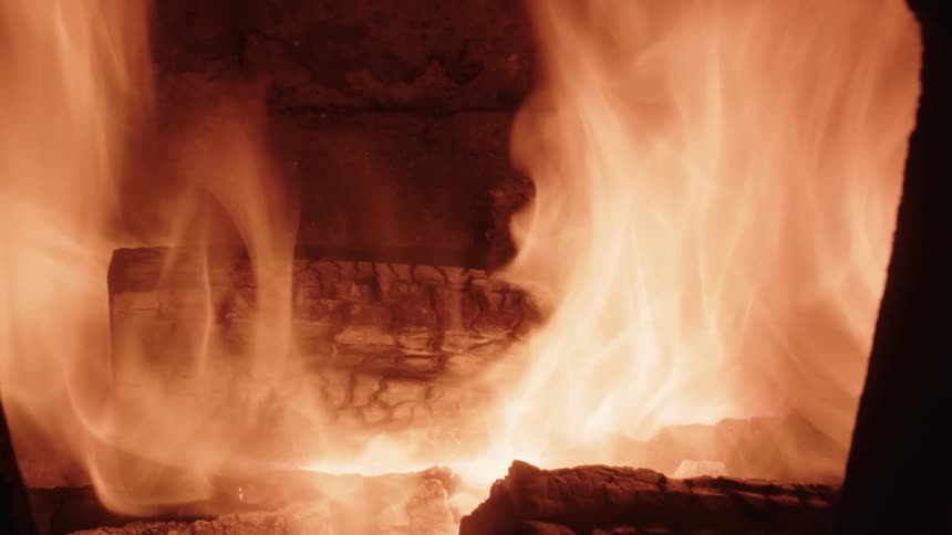 Wood burning inside a stove or fireplace