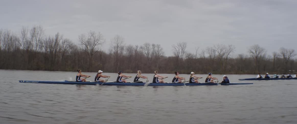A female race crew sweep rowing a racing shell