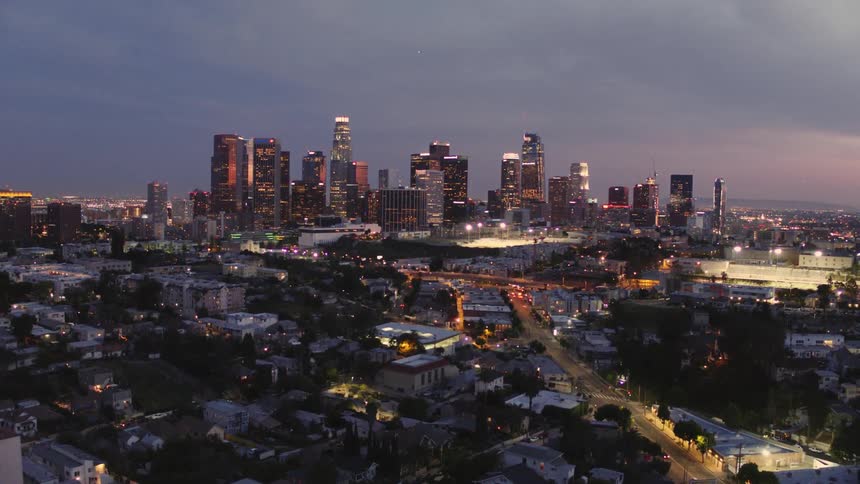 A brightly lit city on a cloudy day
