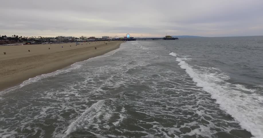 Small waves hit the shore of a beach
