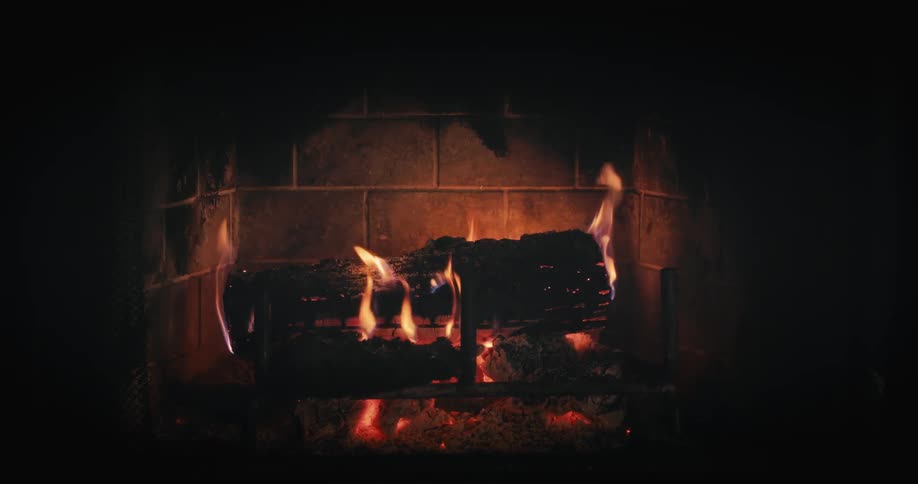 A fugiuria who is burning some wooden logs