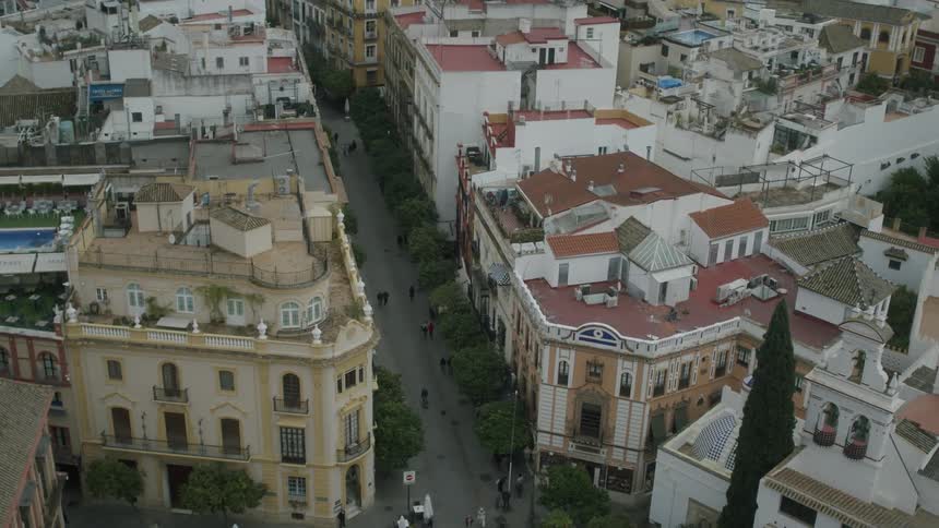 A street in a european city is lined with multistory residences