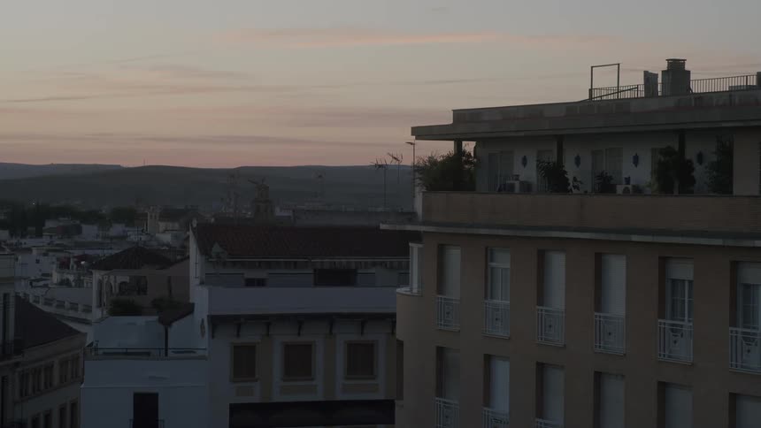 The sun is rising on the city