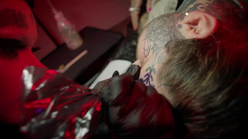 A man is getting a tattoo