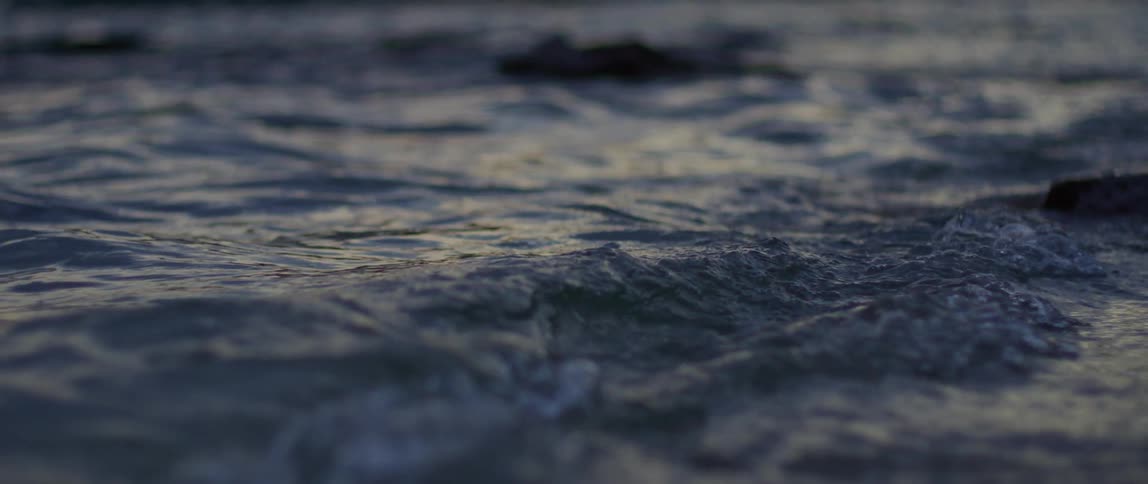 The surface of the water with several small ripples