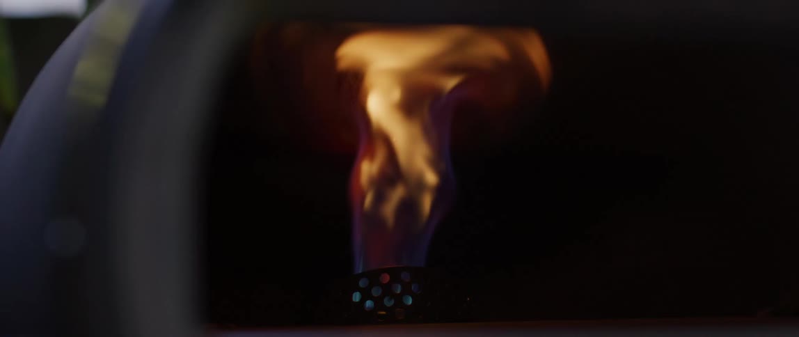 An orange flame of fire coming out of an iron utensil
