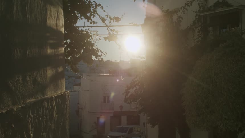 The sun shining through streets in the city