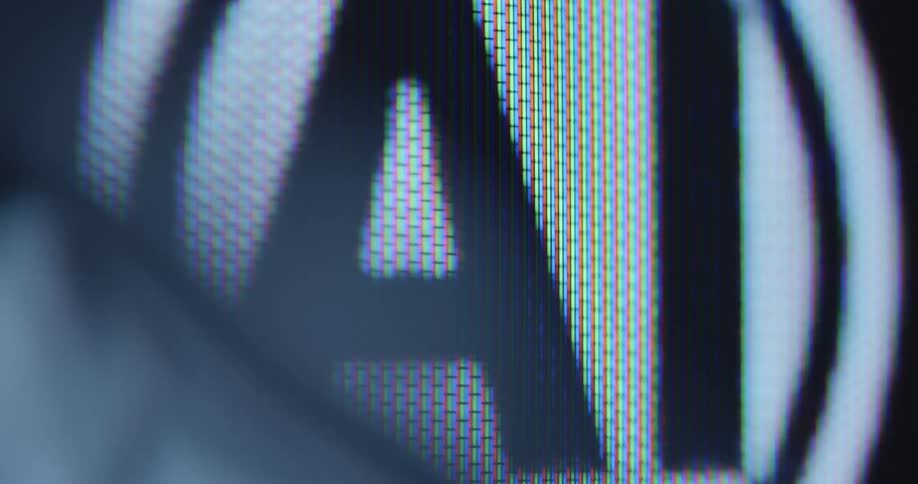 Extreme macro close up of an animated AI icon screened on a computer display that is representing the power and possibilities of artificial intelligence as a technological revolution that will change the modern world