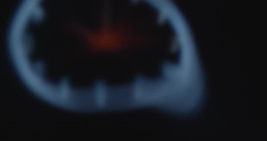 Extreme macro close up of a spinning digital dial or wall clock with many watch hands on a pixelated screen with hectic shaky and stressful camera movement causing panic and anxieties that time is running out