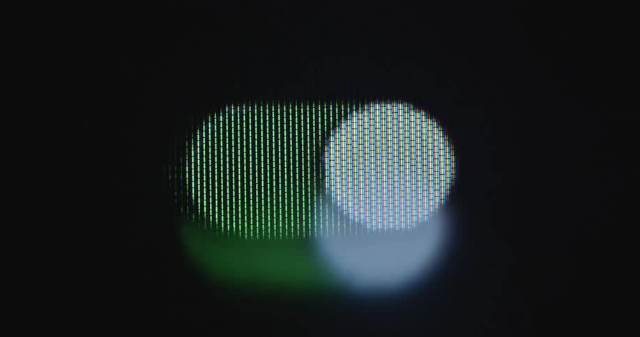 A green and white switch toggles back and forth between on and off while being screened or displayed on a vintage tube TV screen with a pixelated RGB panel