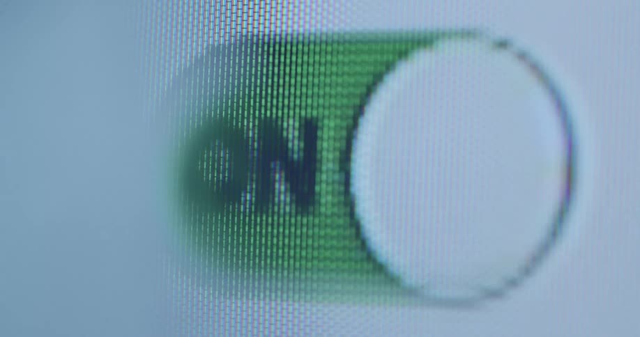 Person swipes touch screen turning indicator off and on repeatedly changing between green and red setting on a pixelated RGB screen with distortion and camera movement